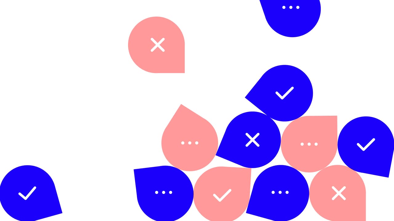 Blue and pink comment pins scattered across a white background, marked with check marks, crosses and ellipses
